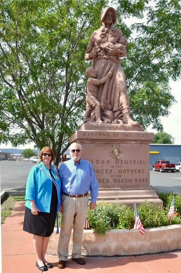 Snapshot of the Madonna of the Trail statue with the DAR insignia added.