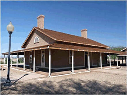 A snapshot of the exterior of a one-story building with a verandah.