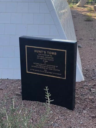 A snapshot of a marker celebrating the addition of Hunt’s Tomb to the National Register of Historic Places, 2008.”