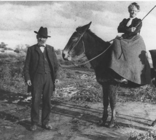 A photograph of Winfield Scott standing and Helen Scott seated side saddle.