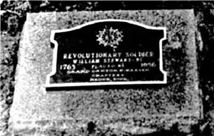 A snapshot of a marker that reads, “Revolutionary Soldier William Stewart [??} / 1763 placed by 1856 / Grand Canyon Chapter, NSDAR 2002.”