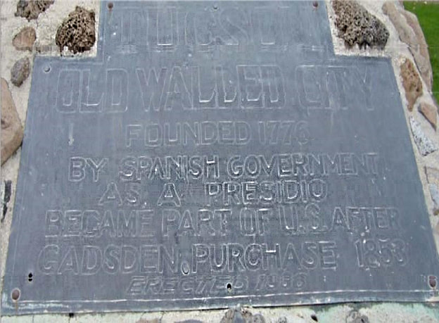 A snapshot of the plaque on a concrete and stone base. Marker text is in the body of this page.