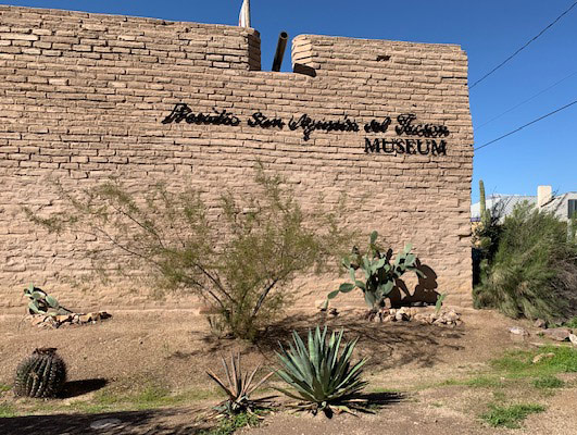 A snapshot of an adobe building exterior. The entrance is not visible.