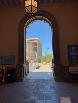 A snapshot of an arched doorway, part of the Pima County Historic Courthouse passageway.