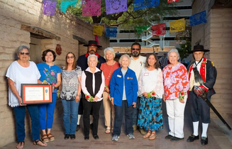 A photo showing eleven descendants of the Presidio soldiers attending the marker dedication.