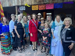 ASDAR State Regent Sarah Ziker is pictured standing with 12 other ladies who assisted in organizing and attending the event.